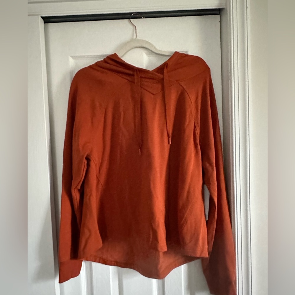 A light weight burnt orange pullover perfect for nights at beach in the summer!